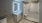 bathroom with mirror with light around it and walk in shower