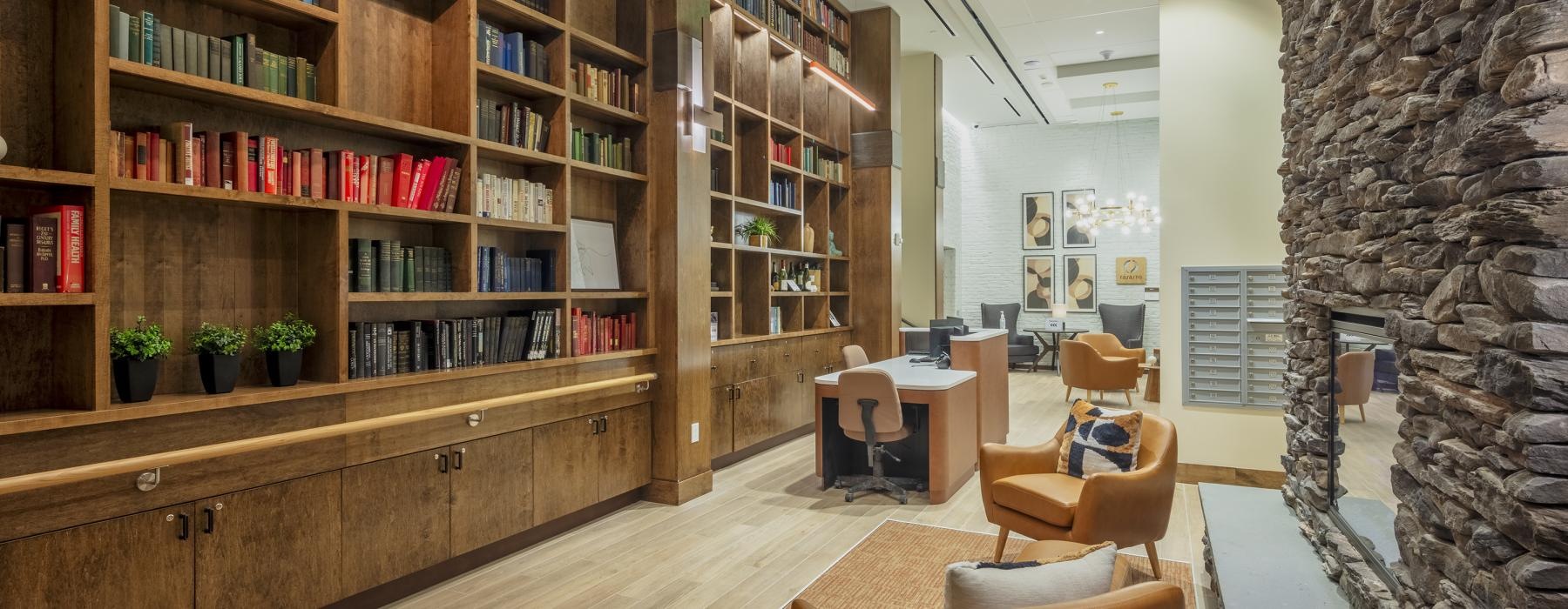 a library with books on shelves and seating