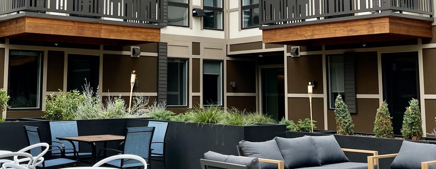 a courtyard with tables and chairs